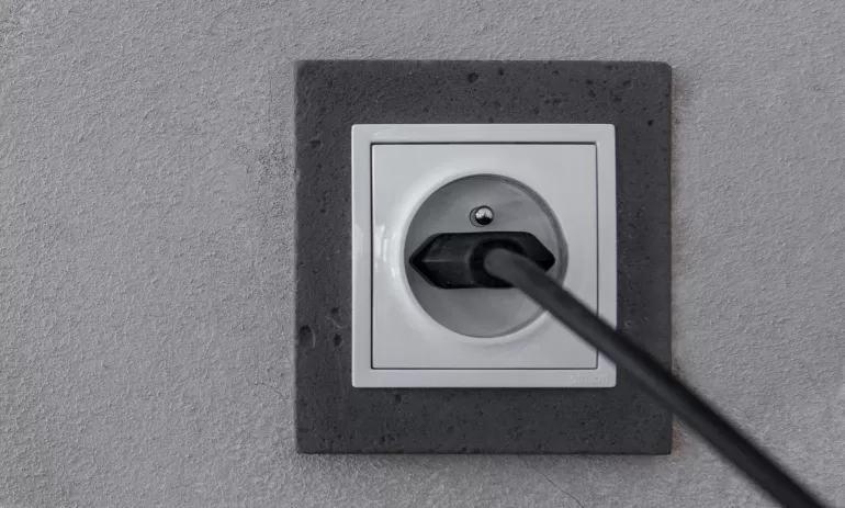 white electrical socket isolated red background