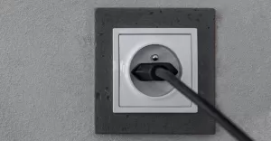 white electrical socket isolated red background